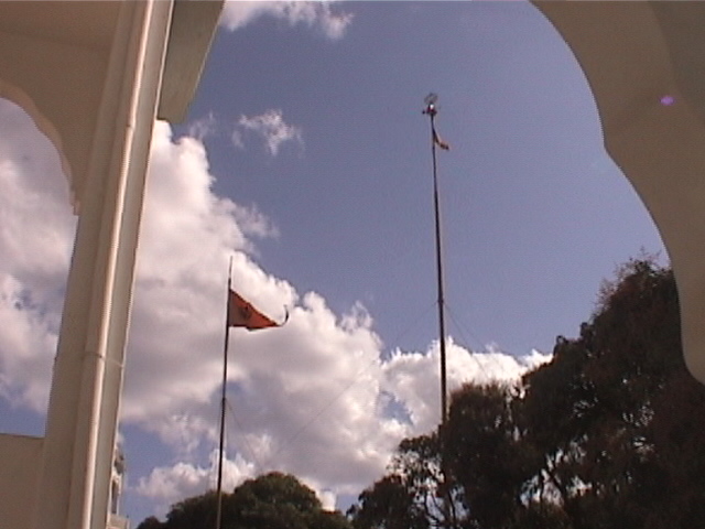 Makindu Sahib Nishan Sahibs. The smaller Nishan Sahib is changed anytime someone wishes to do the sewa. The big Nishan Sahib is changed on Vaisakhi. (circa 2002)