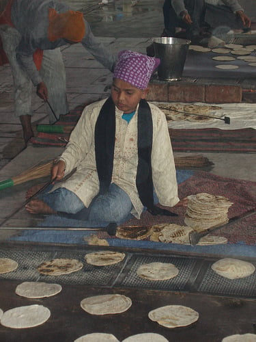 File:Seva - child making rotia.jpg