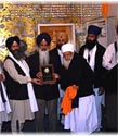 BabaIqbalSinghReceingAward.jpg