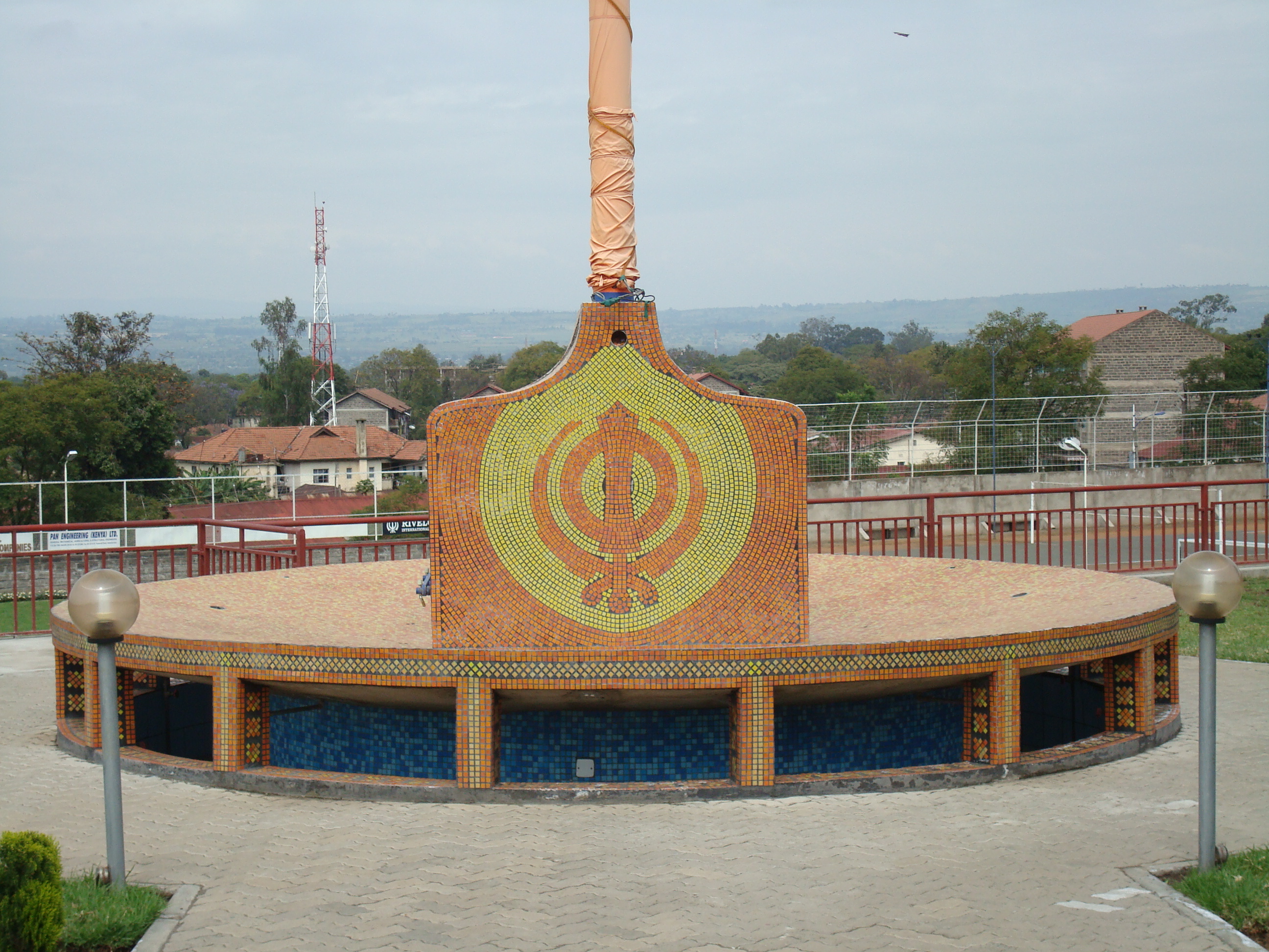 The detailed tiling work on the base of the new Nishan Sahib