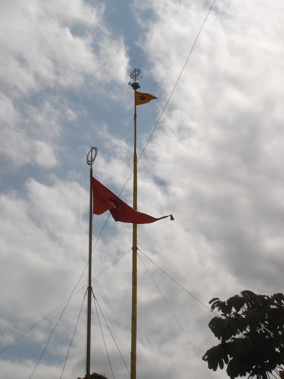 The Nishan Sahibs of Makindu Gurdwara. The smaller Nishan Sahib is changed anytime someone wishes to do the sewa. The big Nishan Sahib is changed on Vaisakhi.(circa 2007)