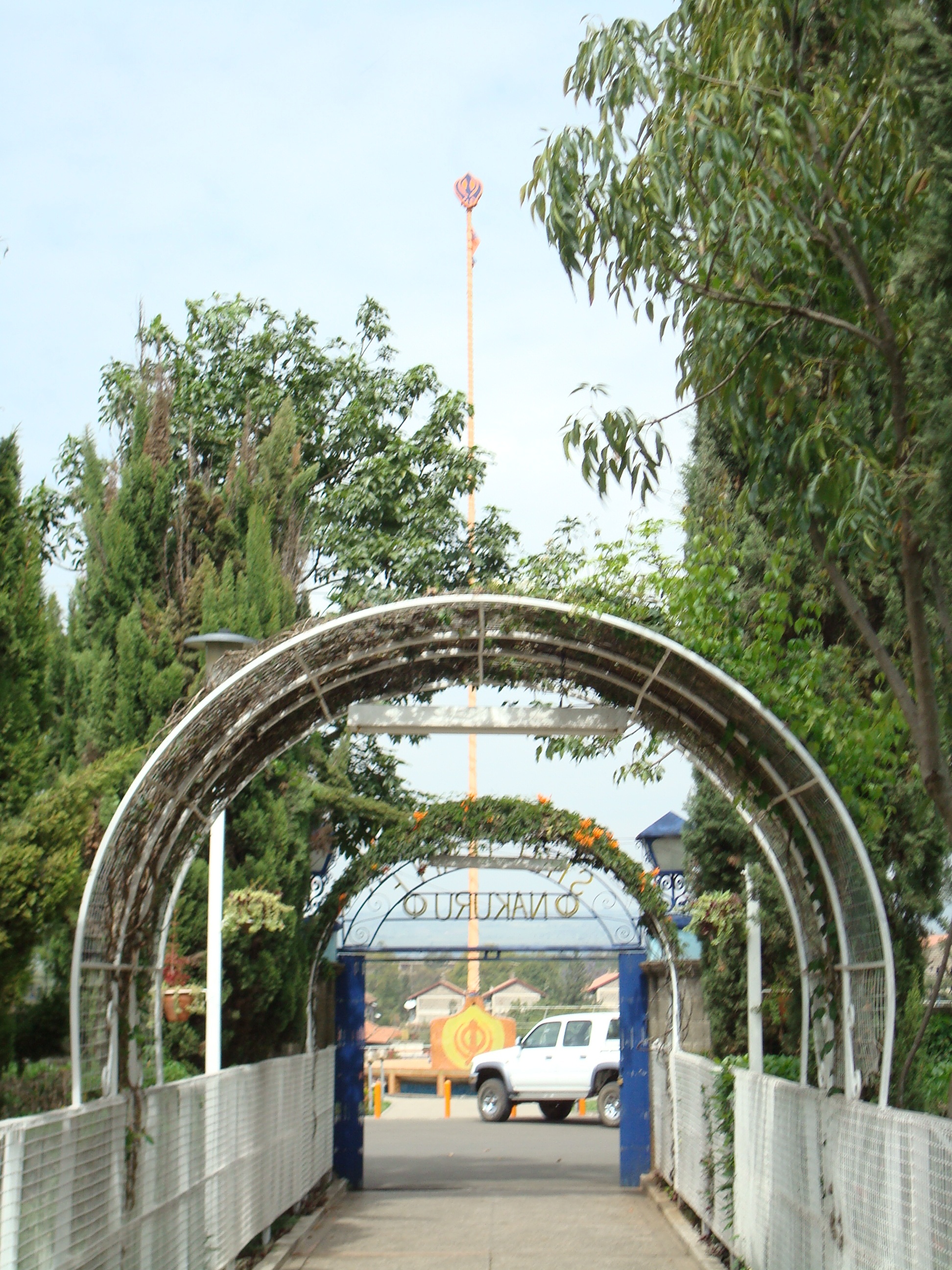 The walkway going to the parking lot. The base of the New Nishan Sahib can be seen in the center