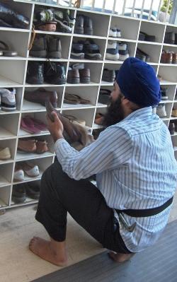 Selfless service cleaning shoes of sangat.jpg