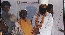 Baba Sukha Singh ji honouring Mr Ali, who has done.jpg