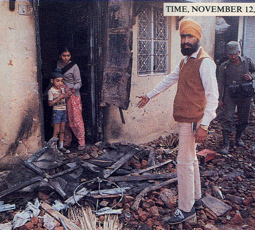 File:Sikh-showing-burned-property-burning-1984-delhi-mod1.jpg