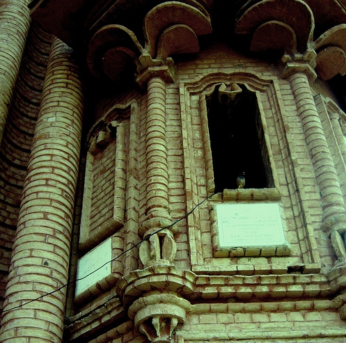 Ground floor details at right of entry, with unique layered petal projections