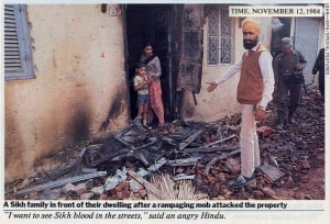 Sikh-showing-burned-property-burning-1984-delhi.jpg