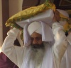 Ragi Baldev Singh carrying the Guru Granth Sahib